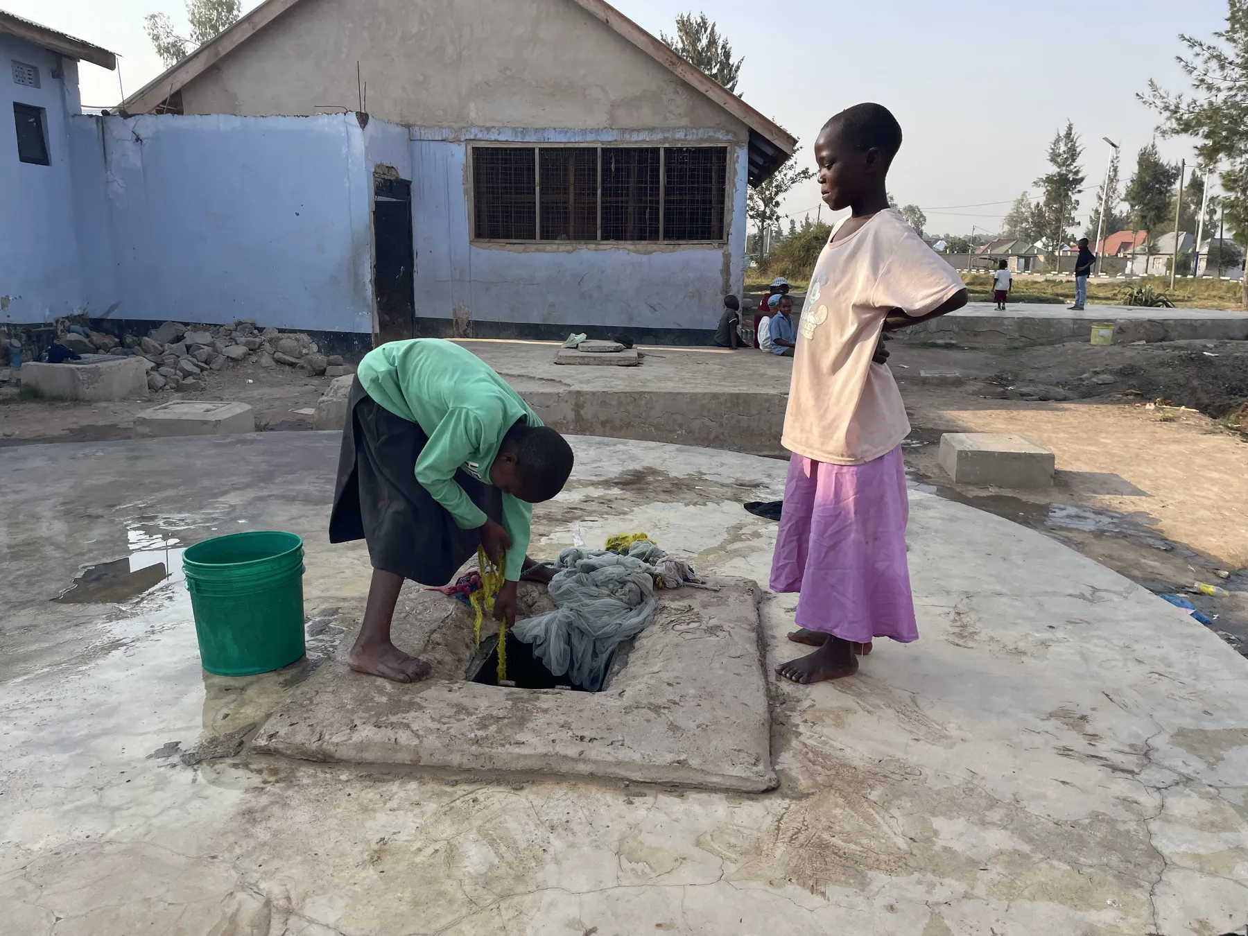 Fetching water from the well at Watoto Wa Africa