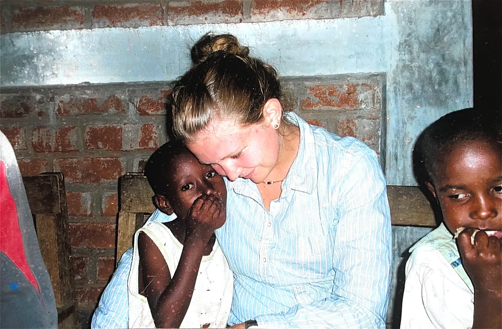 Volunteers and children at Watoto Wa Africa, from the home's earlier years
