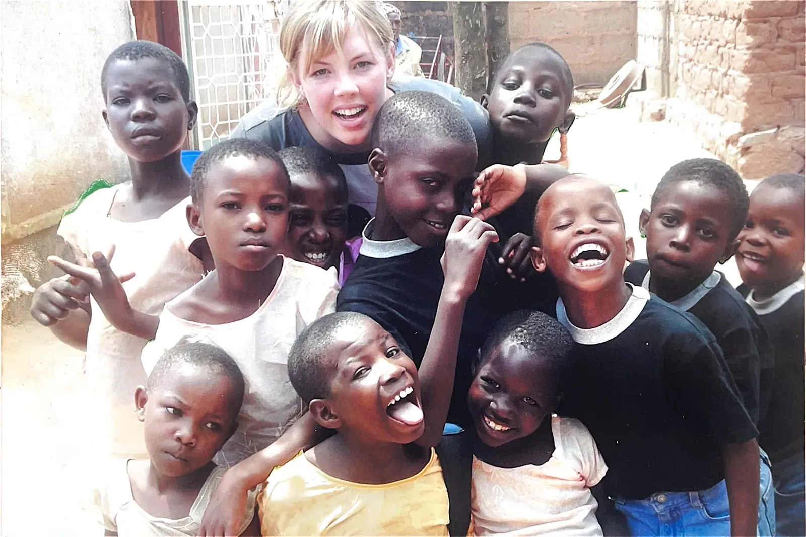Volunteers and children at Watoto Wa Africa, from the home's earlier years